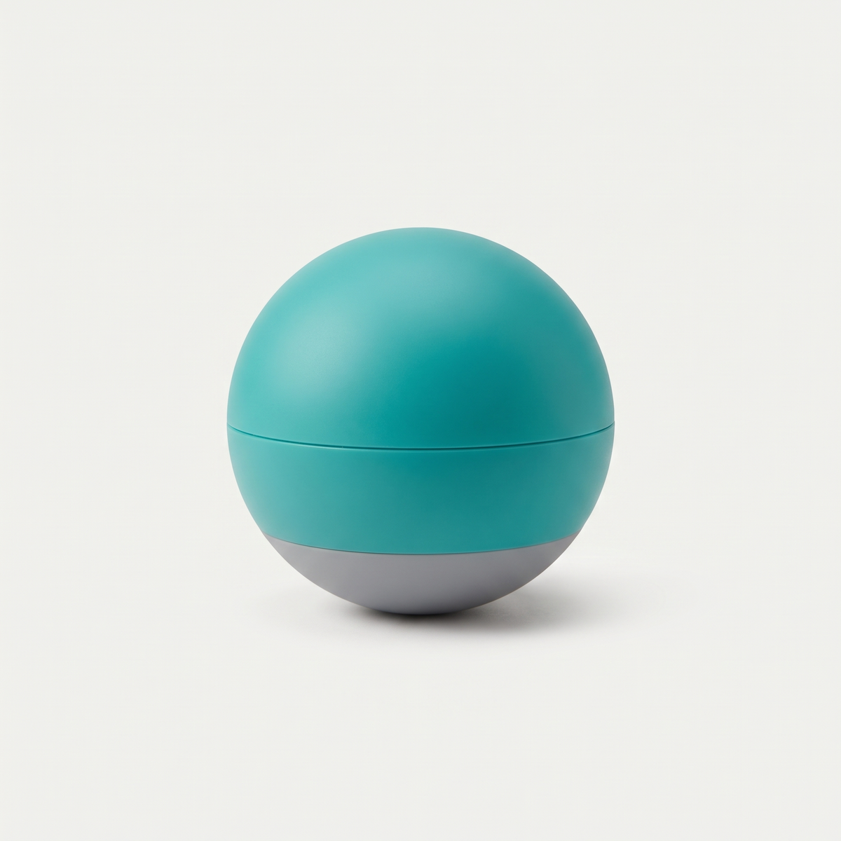Roll Smart Rolling Ball dog toy in matte teal on a light neutral background