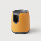 Frenzy Mini Compact Ball Launcher in matte marigold-orange on a light neutral background