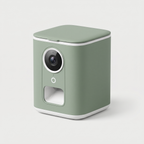 Watch & Treat Smart Pet Camera in matte sage green on a light neutral background