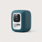 Snack Cam Mini Treat Dispenser in matte deep teal on a light neutral background
