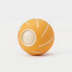 Bounce Smart Bouncing Ball dog toy in matte marigold-orange on a light neutral background
