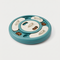 Twist & Find Level 3 Rotating Feeder in matte teal on a light neutral background