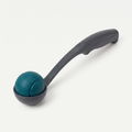 Squeak & Throw Ball + Thrower Set in deep teal and charcoal grey on a light neutral background