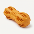 Grizzly Tough Rubber Chew Toy in matte marigold-orange on a light neutral background