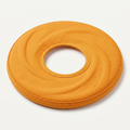 SoftFly Flexible Nylon Frisbee in matte marigold-orange on a light neutral background
