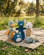 Adventure Pack Plush + Squeaker 5-Pack arranged on an outdoor picnic blanket